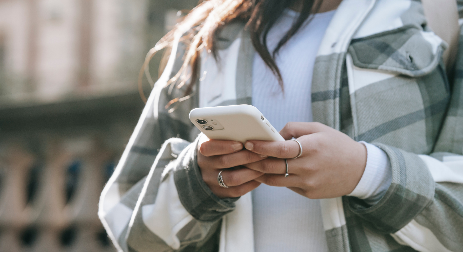 Image of a person holding a phone.